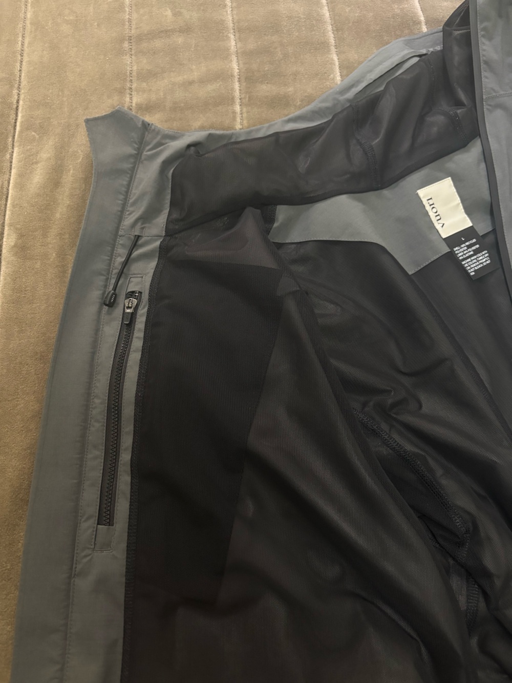 Vuori Oahu Rain Jacket. Two-Tone Hooded Rain Jacket in Dark Gray and Black - Picture 7 of 9
